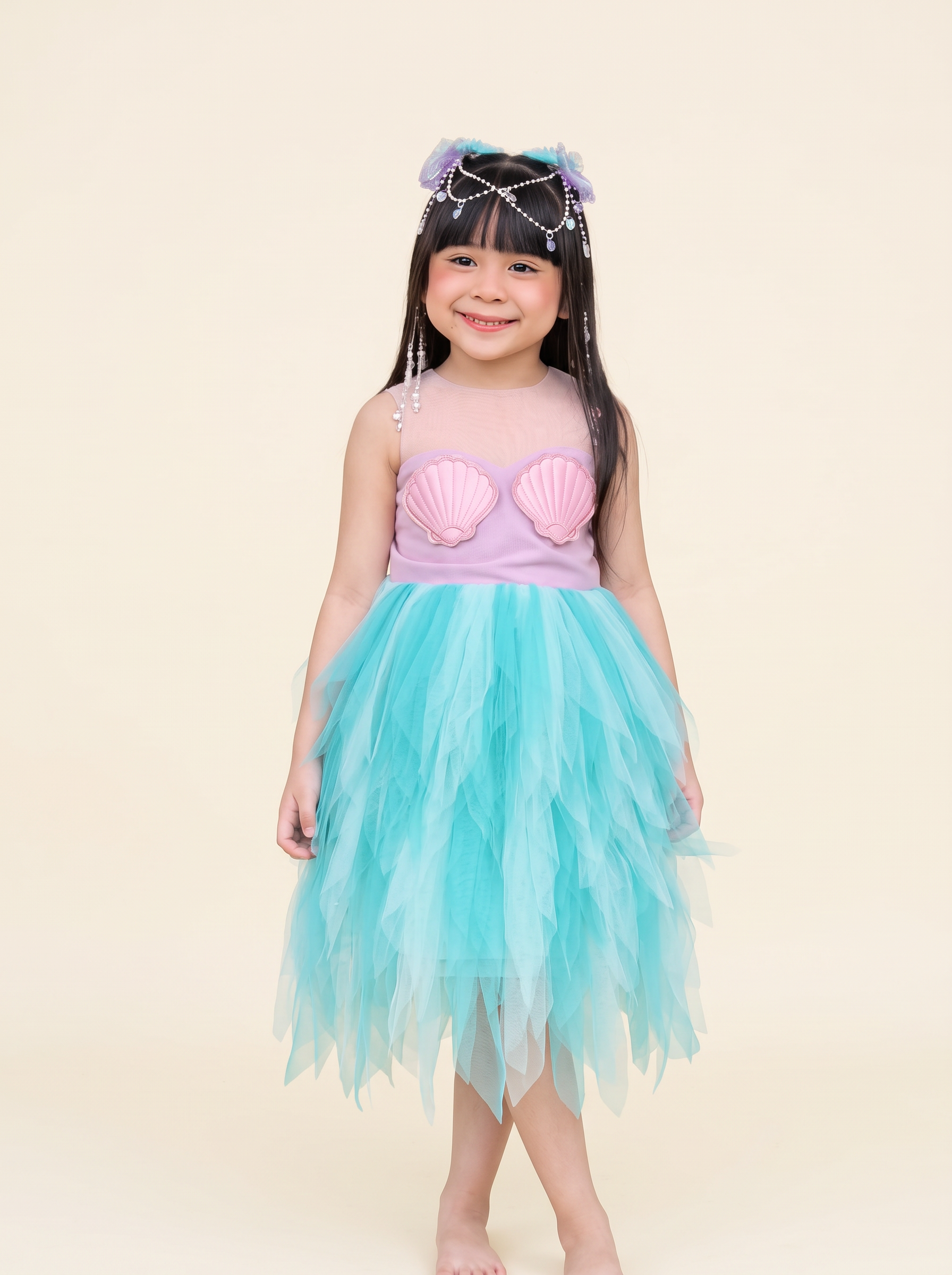 Mermaid costume with pink seashell bodice and aqua tulle skirt